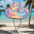 Colorful tie-dye bucket hat on a beach background