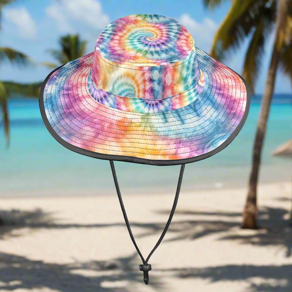 Colorful tie-dye bucket hat on a beach background