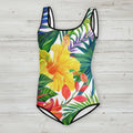 One-piece swimsuit with tropical floral design on a rustic wood background