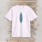 A white short-sleeve crewneck t-shirt featuring a vertical blue surfboard graphic with the text 'My World Is Surfing To Me' on a rustic, whitewashed wooden background.