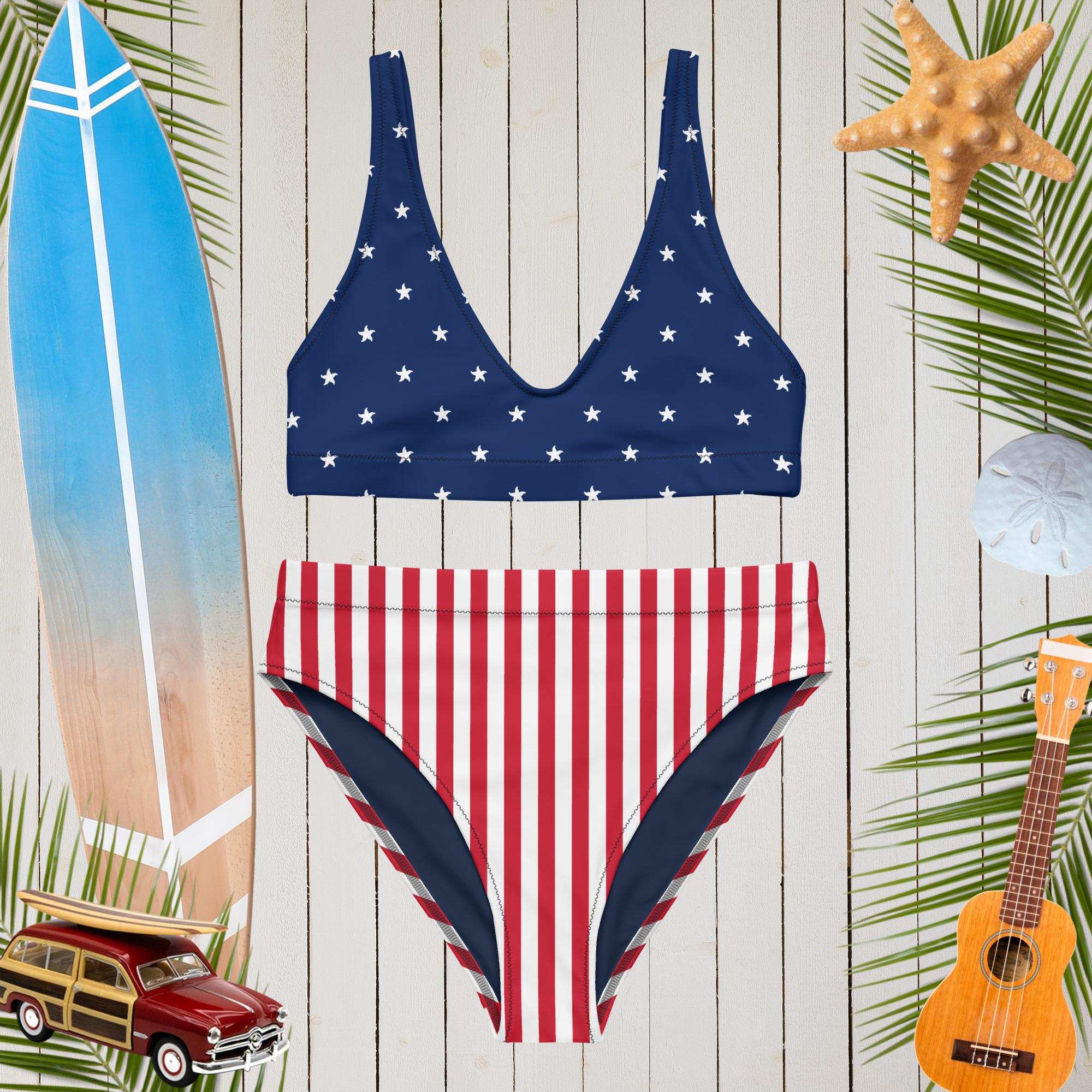 Americana-themed swimsuit with star and stripe pattern on a wooden background with beach accessories.