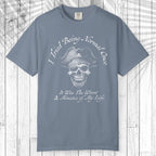 A slate blue short-sleeve t-shirt with a white graphic of a pirate skull and the text 'I Tried Being Normal Once. It Was The Worst 2 Minutes of My Life.