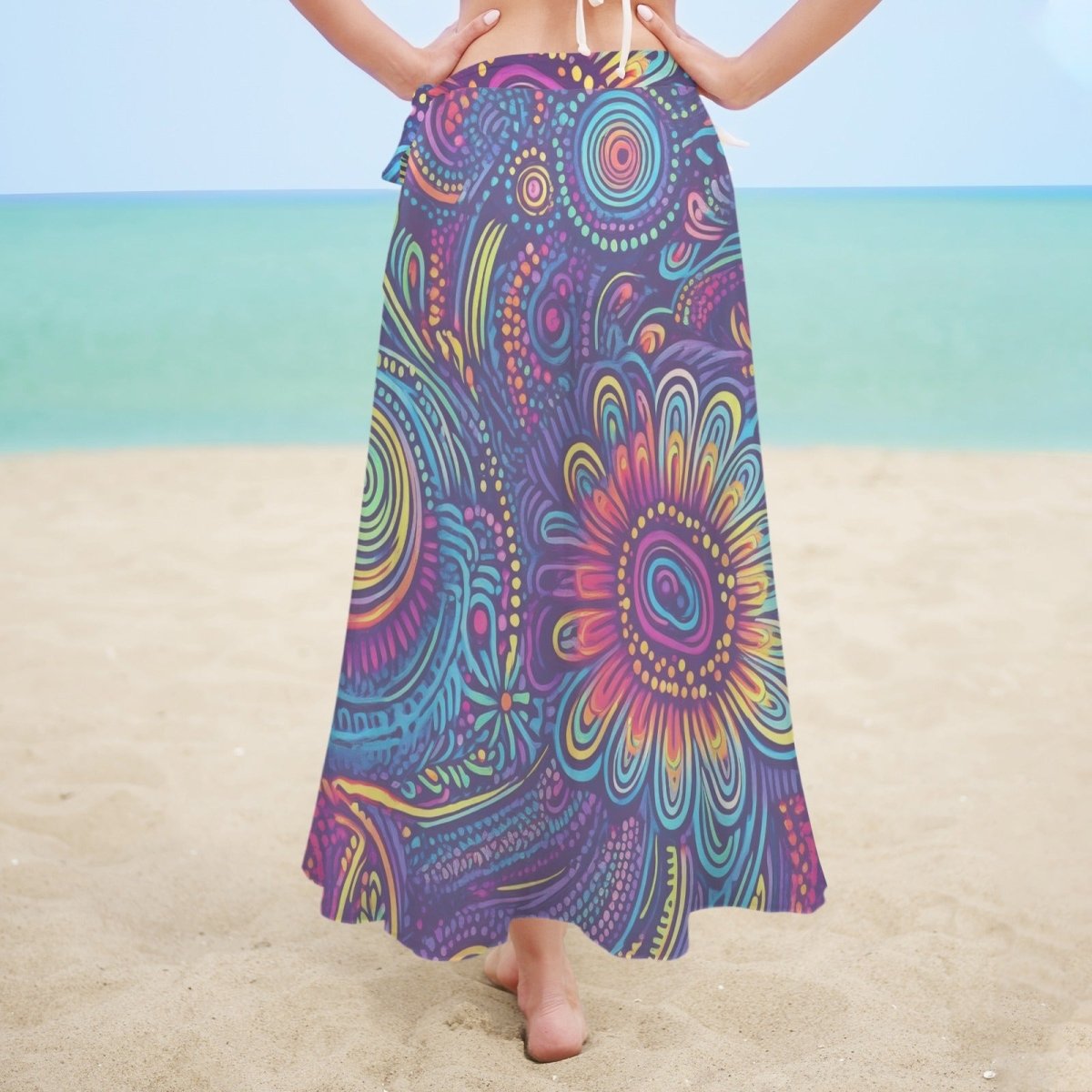 Person wearing a colorful patterned island tribal sarong on a beach