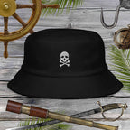Jolly Pirate Flag Bucket Hat made of unstructured terry cloth with skull design on a wooden background.