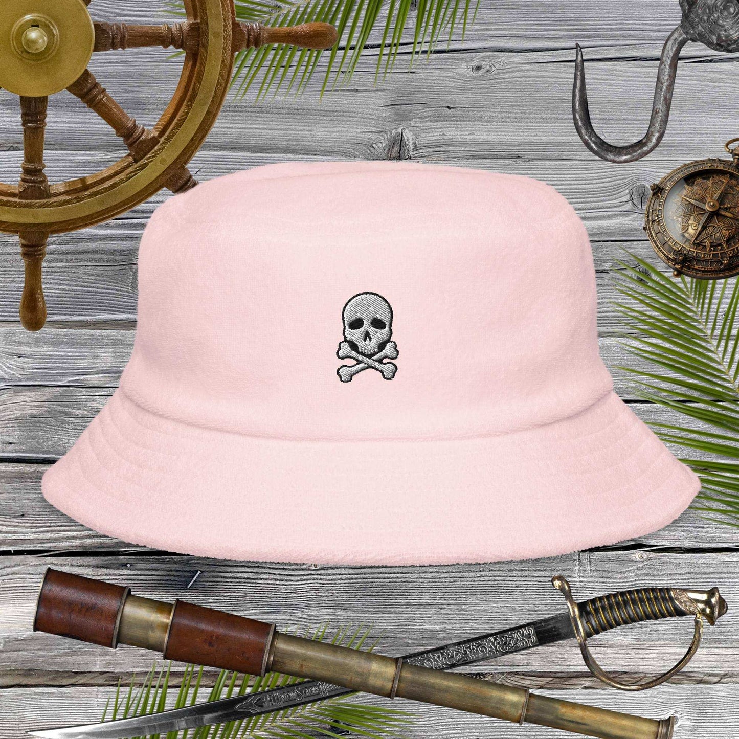 Jolly Pirate Flag Bucket Hat in soft pink with skull design, perfect for beach adventures and sunny days.