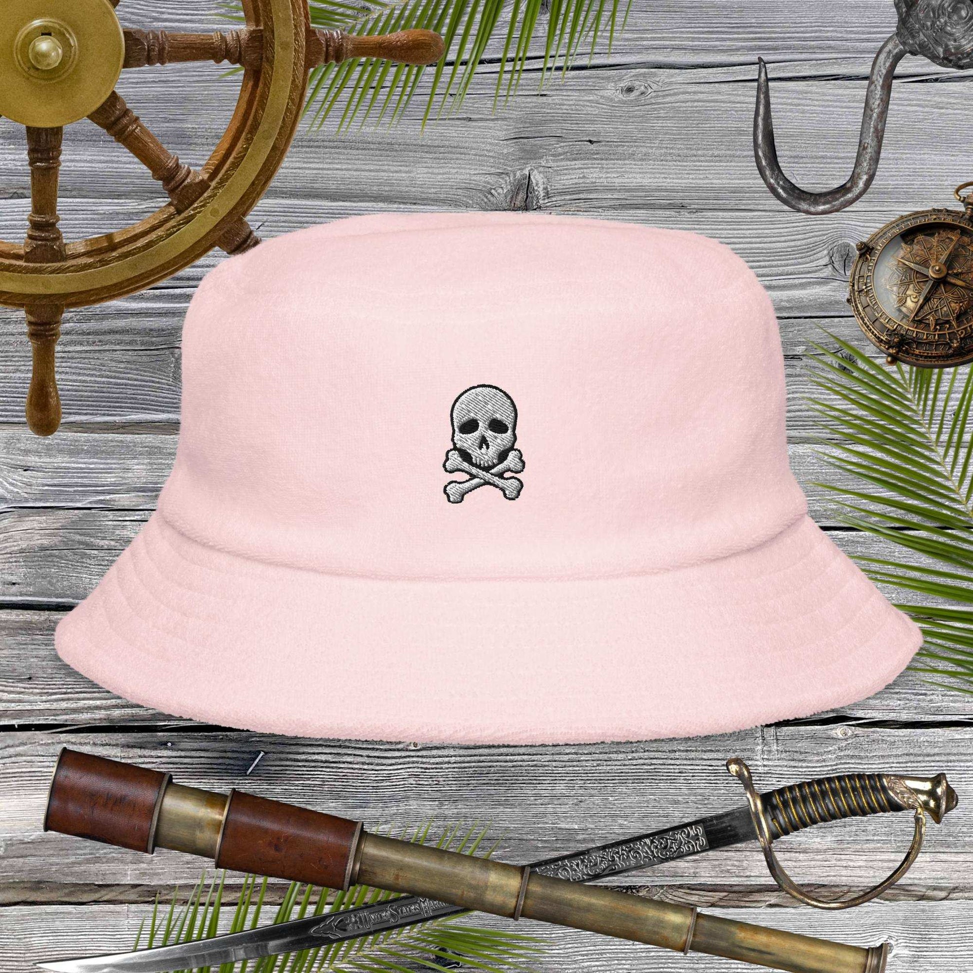 Jolly Pirate Flag Bucket Hat in soft pink with skull design, perfect for beach adventures and sunny days.
