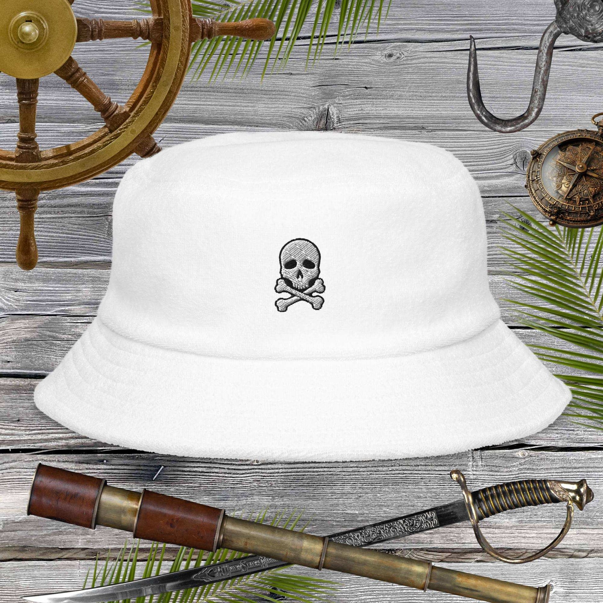 Jolly Pirate Flag Bucket Hat in white terry cloth with skull and crossbones design, perfect for beach adventures.