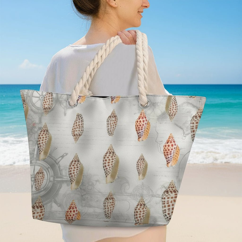 Person holding a tote bag with shell pattern in on the beach
