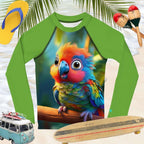 Green long-sleeve sun rashie shirt with a colorful parrot design on a beach-themed background with flip-flops, maracas, and a toy van.