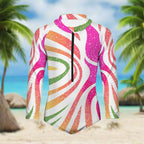 Colorful long-sleeve swimsuit with a pattern on a island beach background