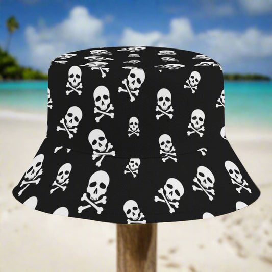 Black bucket hat with white skull and crossbones pattern sitting on a post in a Caribbean island beach