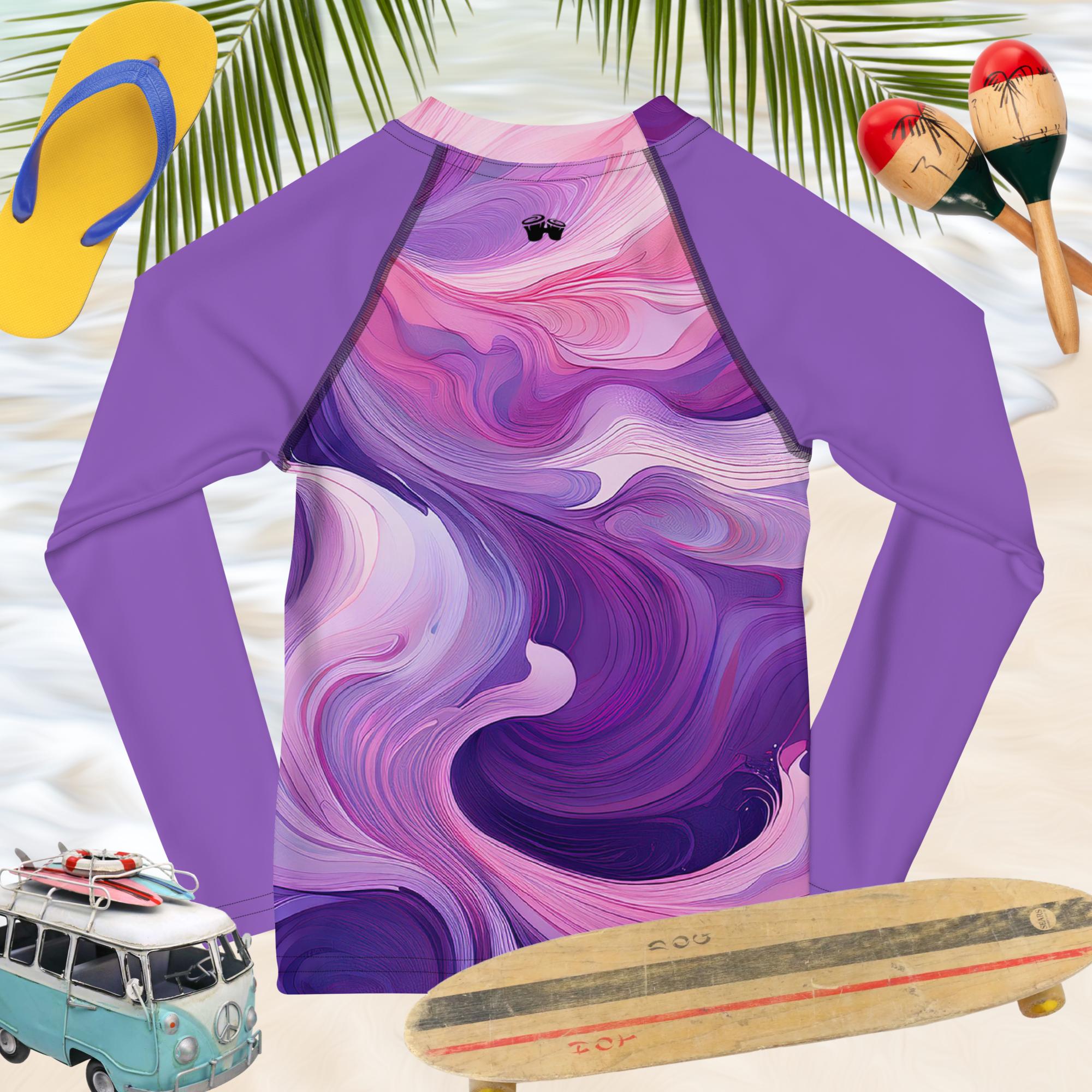 Kids rash guard in lavender swirl pattern with UPF 50+ protection, perfect for beach fun and outdoor play.