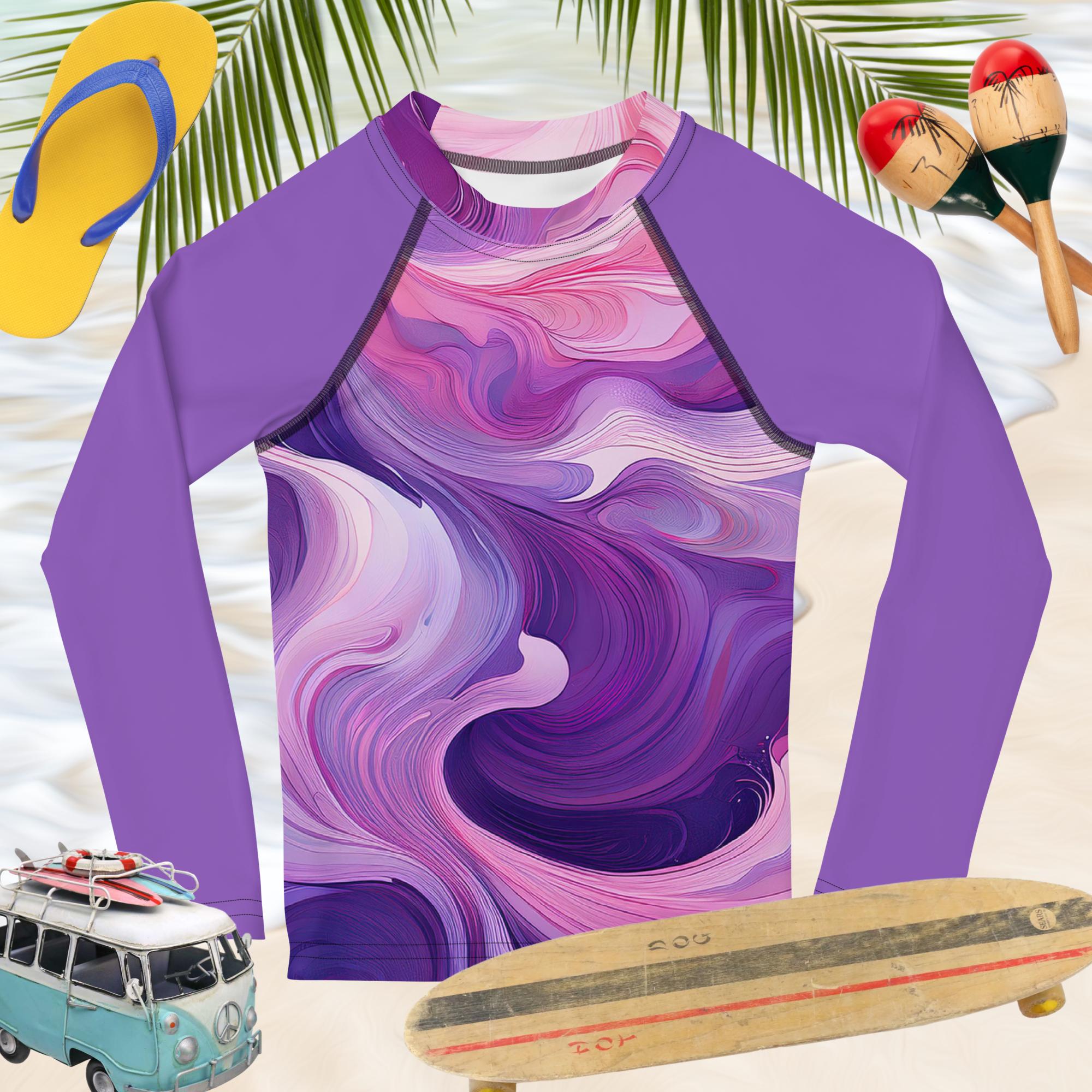 Vibrant lavender and pink kids rash guard with wave pattern, perfect for beach play with UPF 50+ protection.