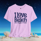 A light purple heather t-shirt with the text 'I Love The Beach and 2 maybe 3 People' in navy blue, displayed on a beach background with sand, shells, and a starry night sky.