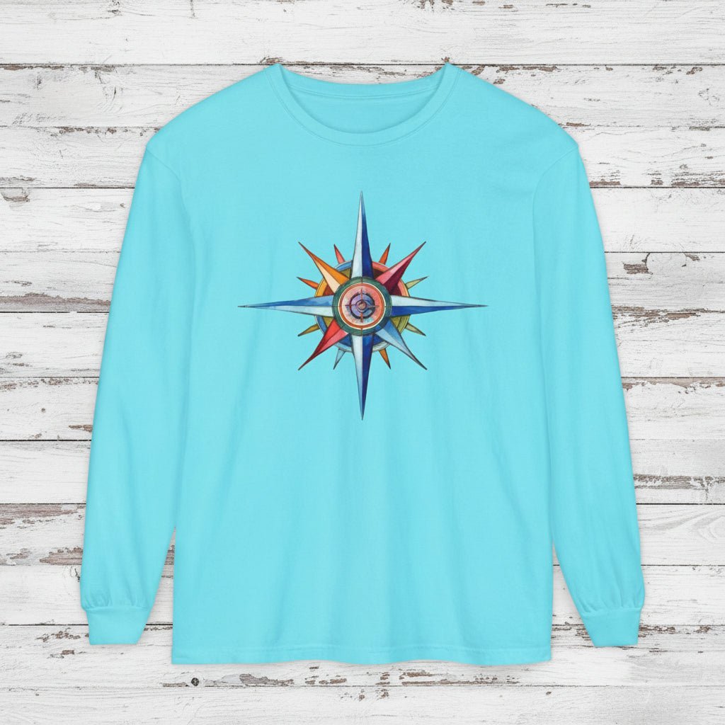 Light blue long-sleeve shirt with a colorful compass design on a white background
