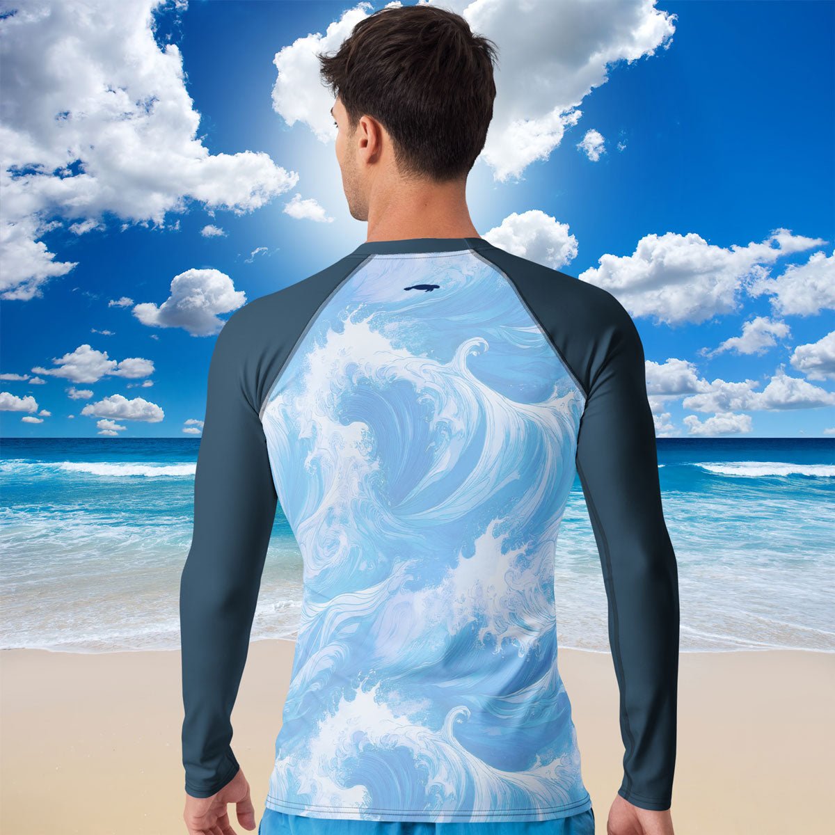 Person wearing a long-sleeve Clean Seas Society Rash Guard swim shirt  with wave design on a beach