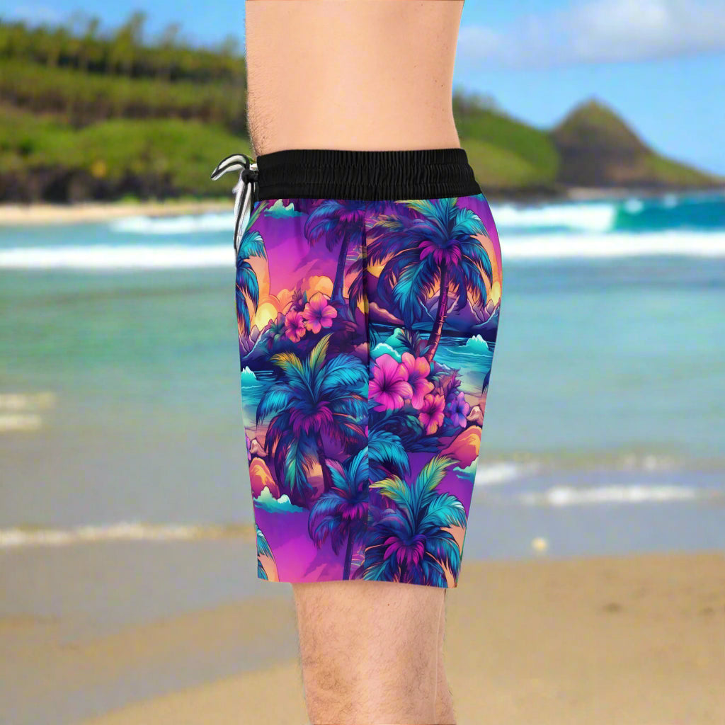 Side view of surfer dude wearing Hawaiian style Luau Shorts on the beach in Oahu