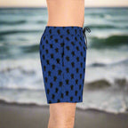 Dark Blue Bathing trunks on a guy standing on the beach