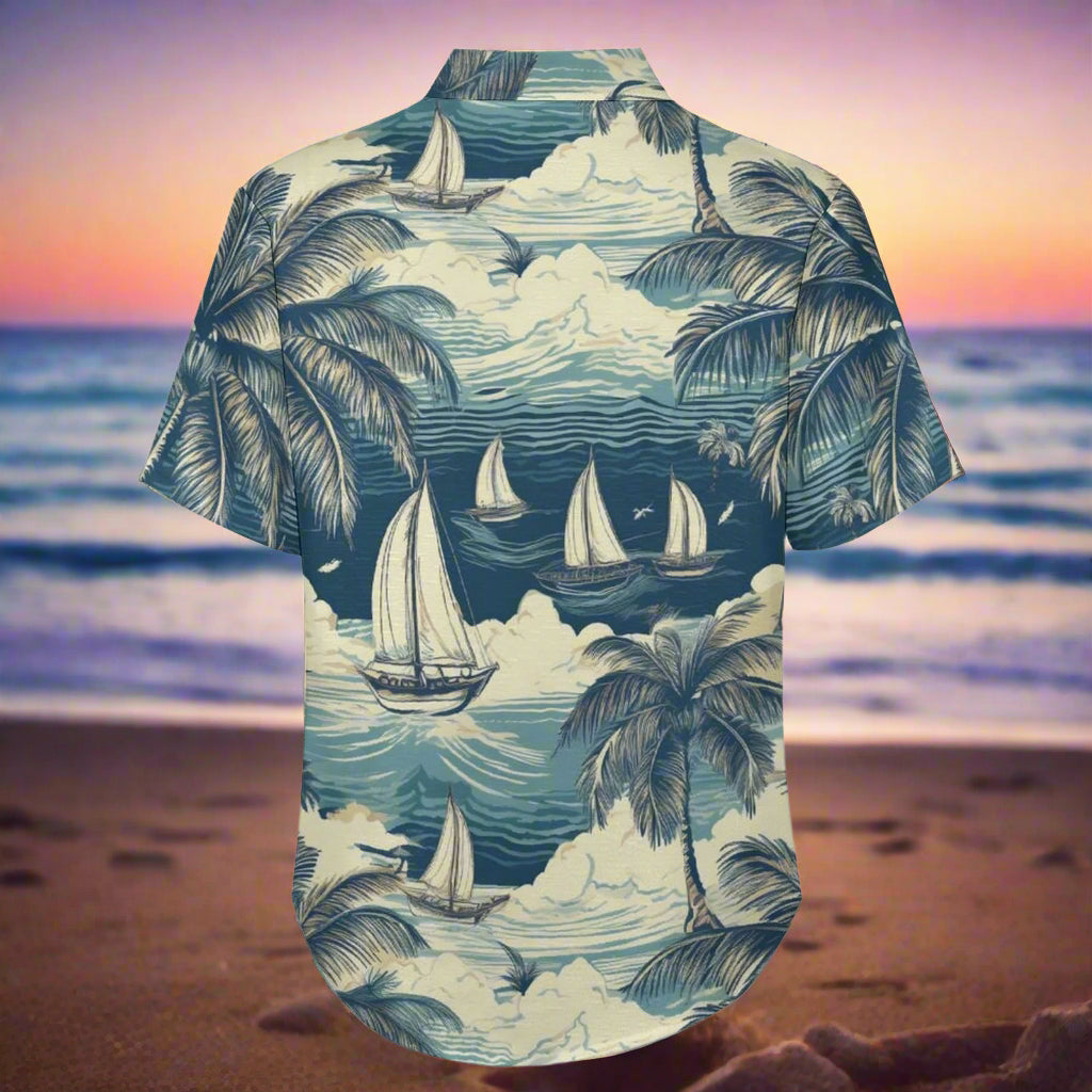 Short-sleeve button-up shirt with a tropical design featuring sailboats and palm trees on a beach sunset background.