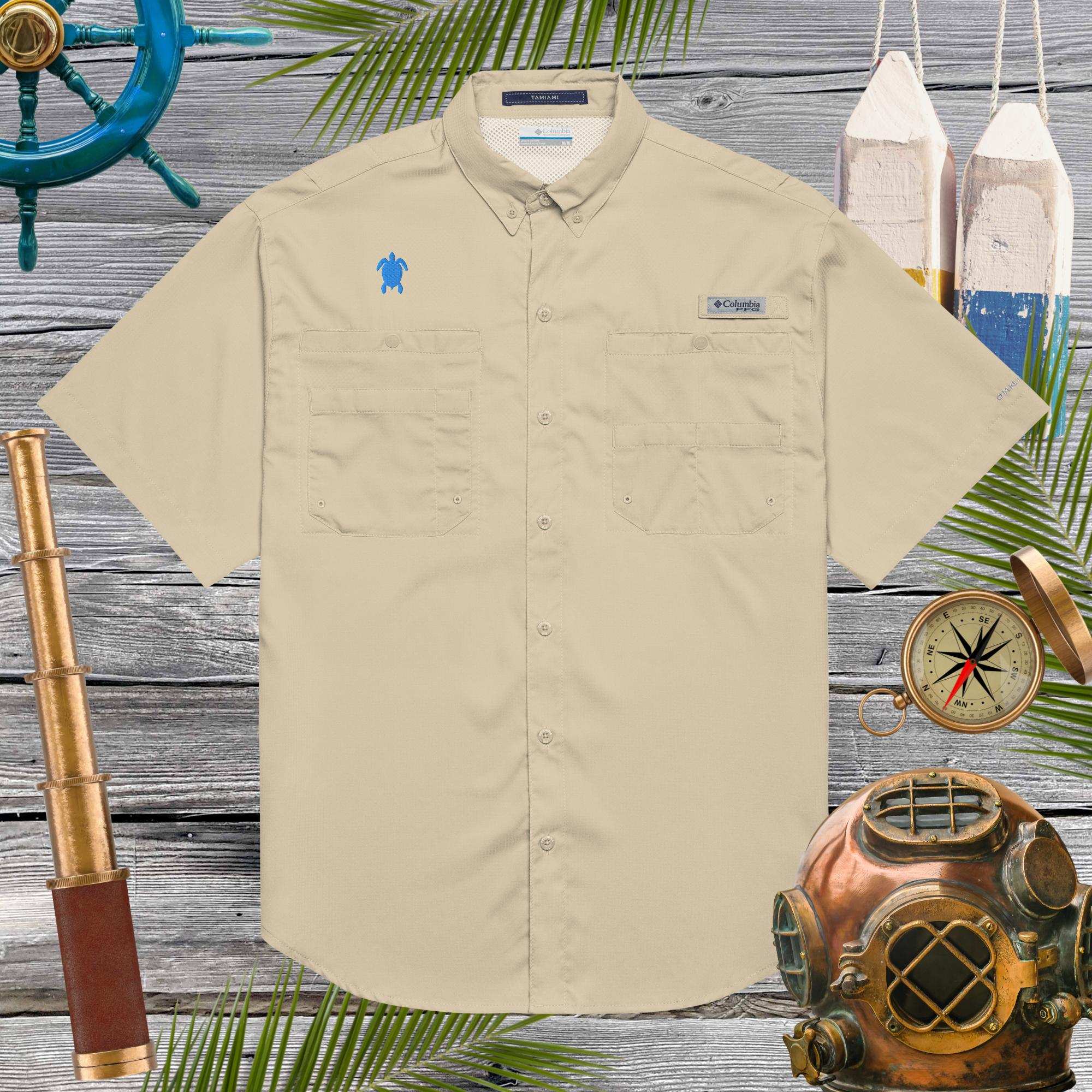 Beige shirt with sea turtle embroidery on a wooden background with nautical-themed decor
