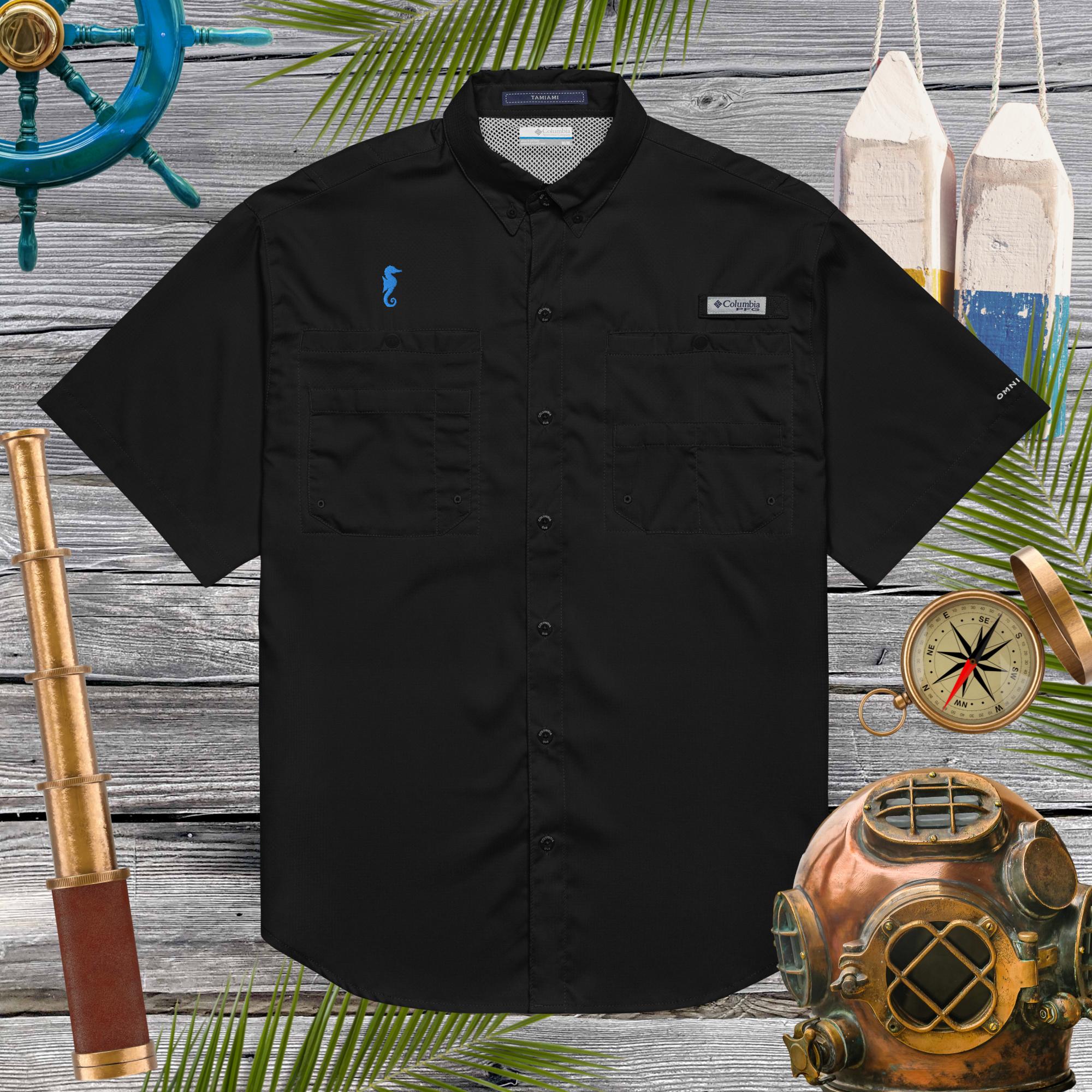 Black short-sleeve shirt with brand logos on a wooden background with nautical-themed decorations.