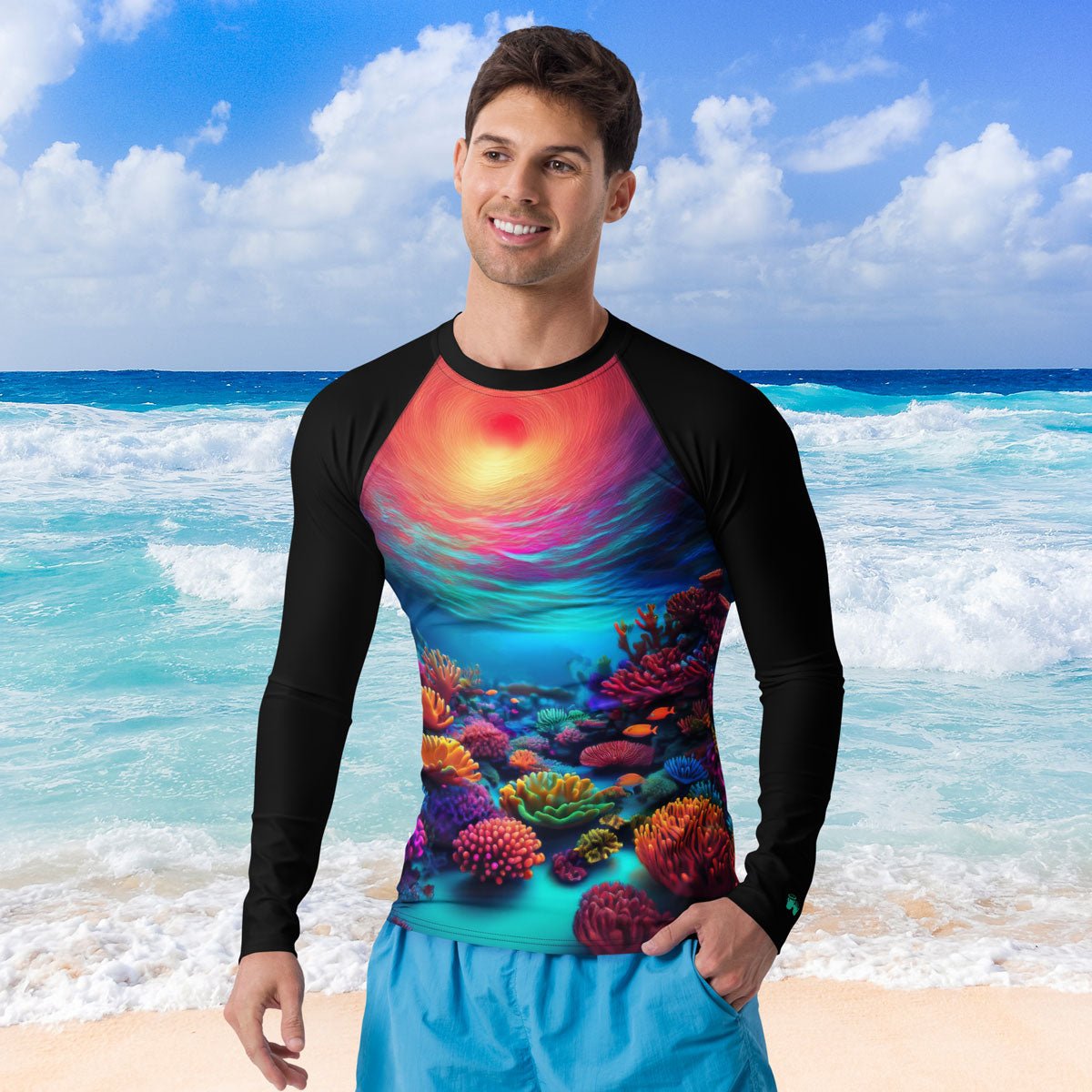 Man wearing a colorful coral reef shirt on a beach with ocean in the background