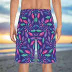 Backside of Men's Junonia Pattern Board-shorts as worn by sheller searching for rare seashells on an empty beach at sunrise.