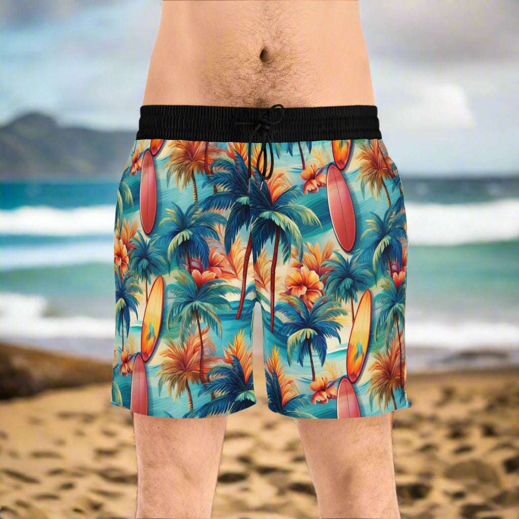 Guy wearing Board shorts with vintage Hawaiian pattern standing on the north shore of O'ahu