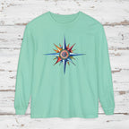Mint green sweatshirt with a colorful star design on a wooden background