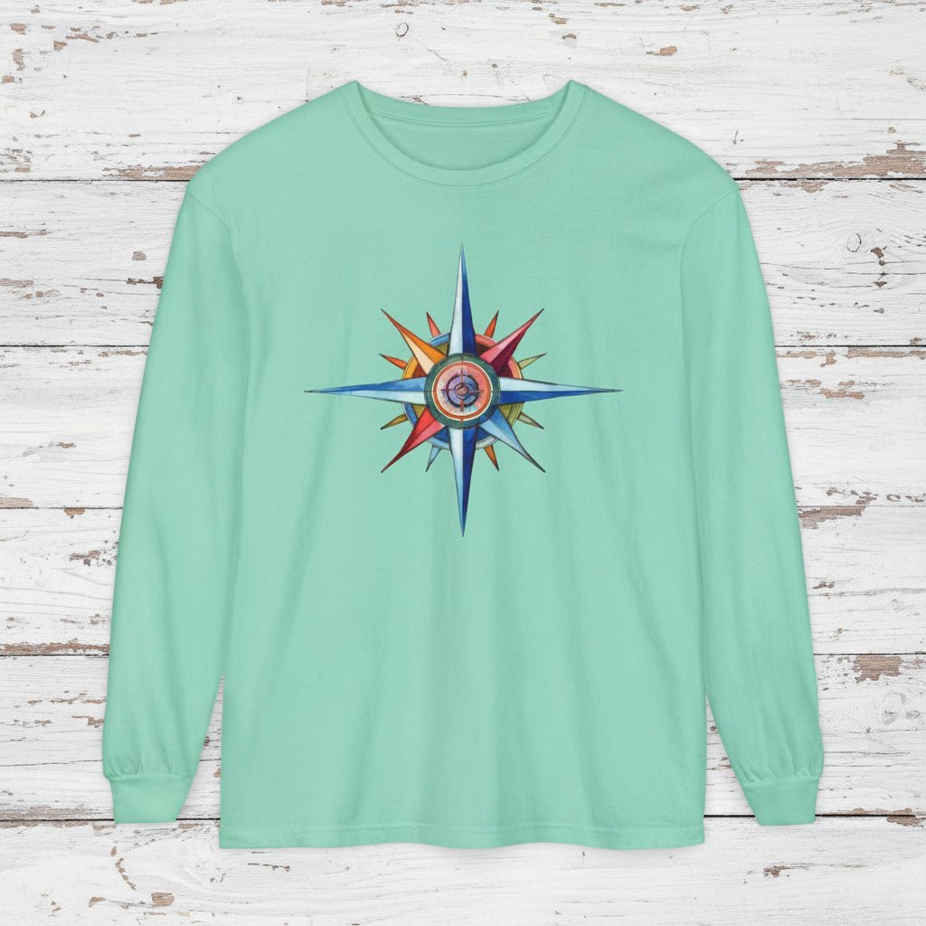 Mint green sweatshirt with a colorful star design on a wooden background