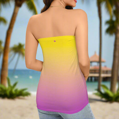 Lady ParrotHead wearing a strapless dress with yellow to purple Ombré design standing on a beach in St. Somewhere