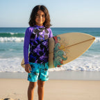 A long-sleeve raglan rash guard with solid purple sleeves and collar, featuring a black chest panel printed with a repeating pattern of purple and blue fish skeleton illustrations.