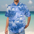 Salty Dude wearing a blue Hawaiian shirt with ship and palm tree pattern standing on a beach in the Caribbean