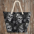 Beach bag with pirate skull design and rope handle on a rustic nautical wood background