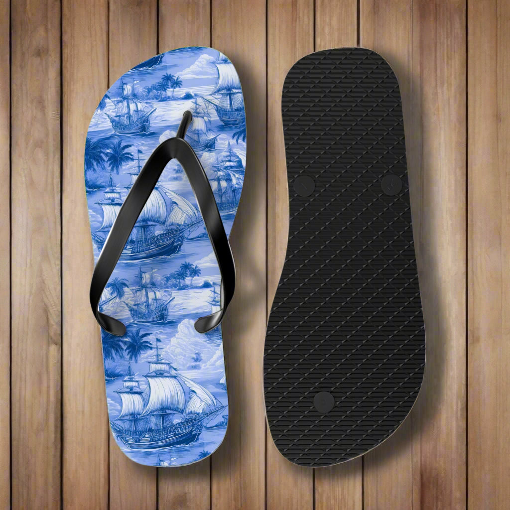 Flip-flop with nautical design and black insole on a rustic wood background