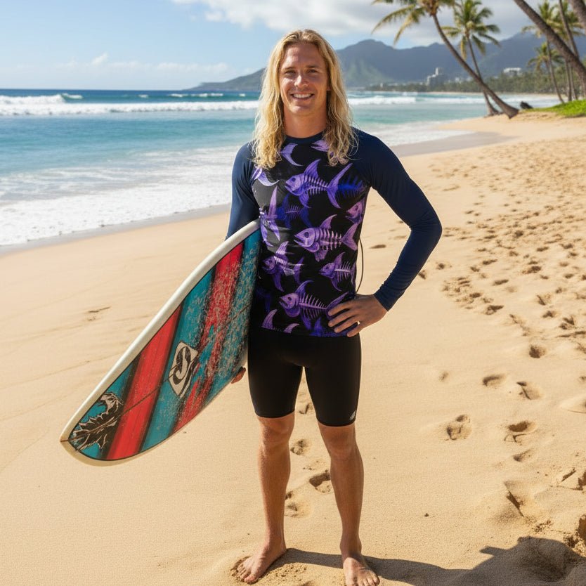 surfer dude wearing a long-sleeve rash guard with purple fish skeleton pattern on North Shore Beach Oahu