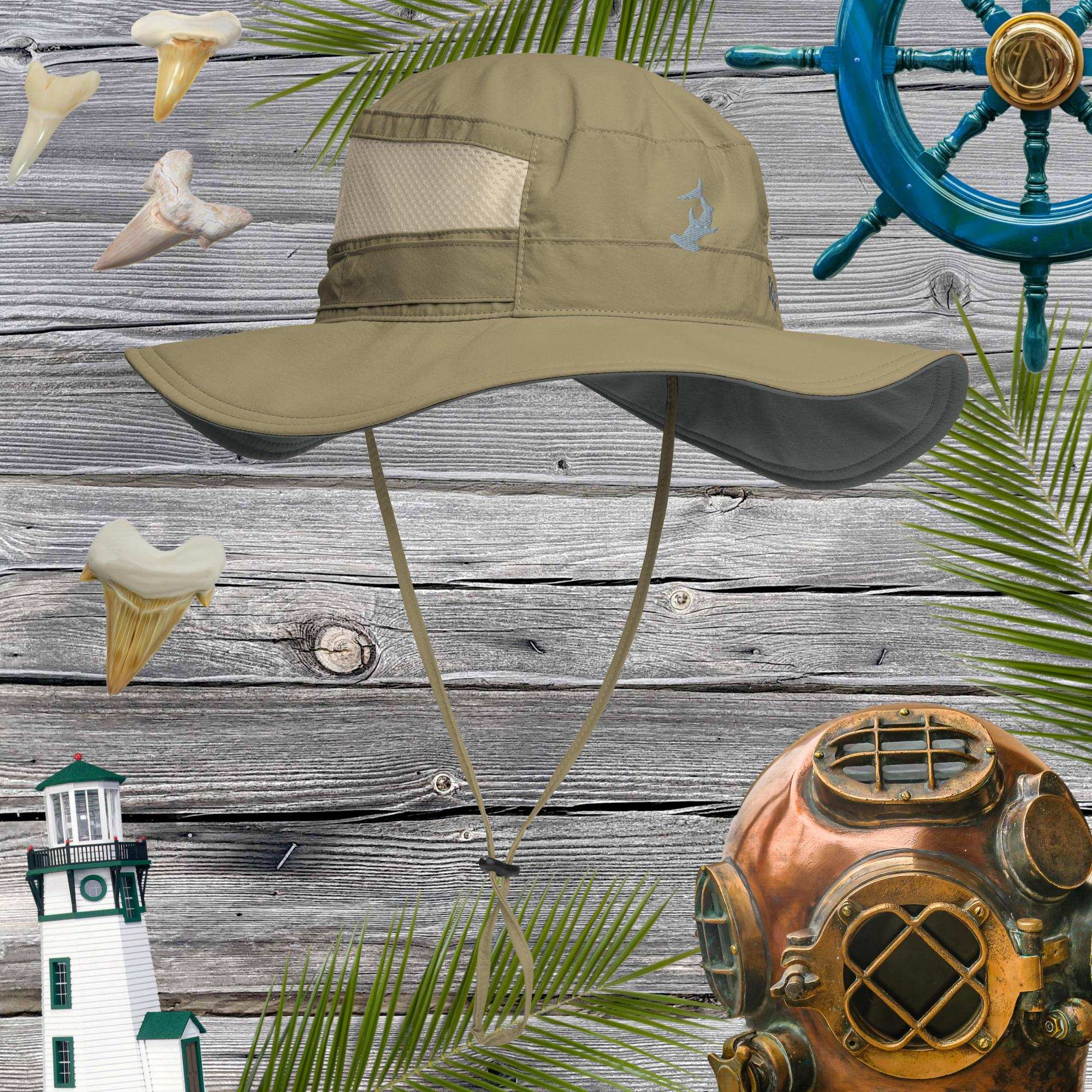 Beige booney hat on a wooden background with nautical decorations like a lighthouse, shark teeth, and a diving helmet.