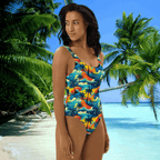 Swimwear model standing on beach in paradise wearing a Hawaiian Dreams One-Piece Swimsuit by Bongo Beachwear