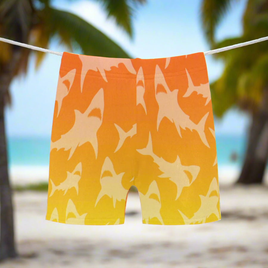 Shorts with orange Ombré shark pattern hanging on a clothesline in Key West