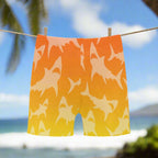 Orange and Yellow Shark-patterned shorts hanging on a clothesline in Maui
