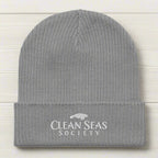 Light Grey Organic Beanie wiht Clean Seas Society logo on a nautical wood background