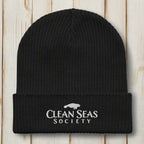 Black Organic Clean Seas Beanie on a nautical wood background