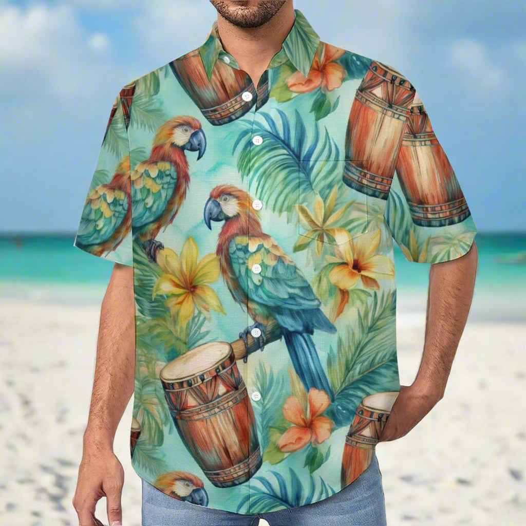 ParrotHead Dude wearing a colorful Hawaiian shirt with parrots, Bongos, and tropical leaf design standing on a beach in Key West.