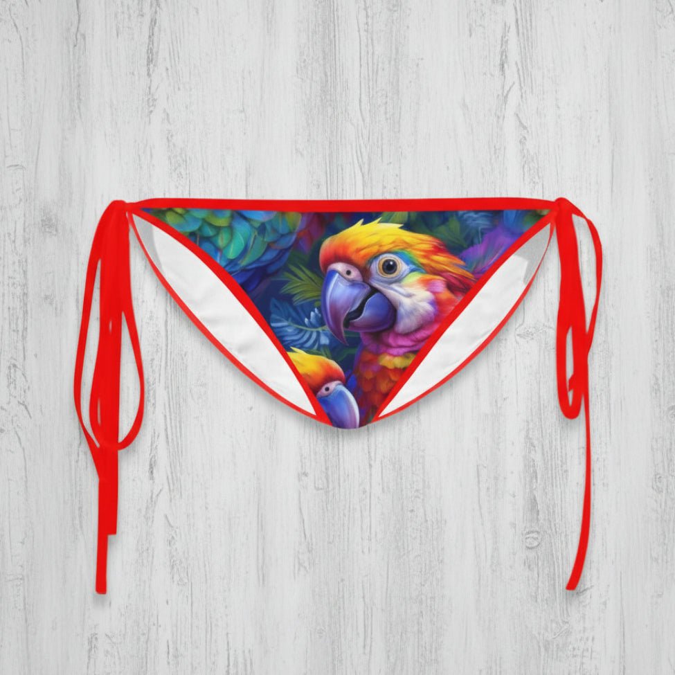 Bikini bottom with parrot design and red straps on a white background