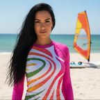 Beautiful Woman in Colorful long-sleeve sun rashie with a vibrant pattern on PCB Florida 