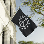 Black flag with white skull design and 'mafia' text on a building exterior.