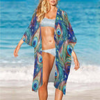 Woman wearing a peacock print bikini cover on a beach