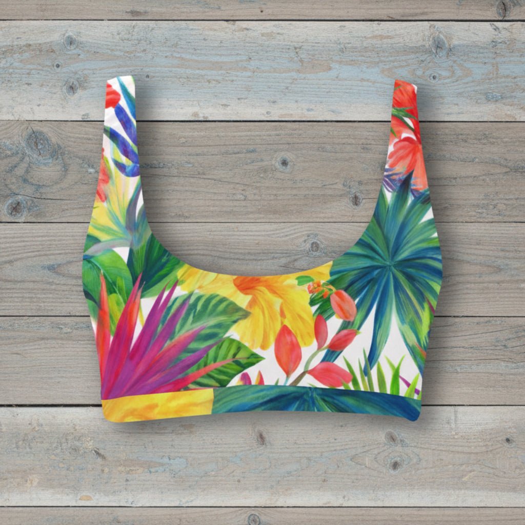 Colorful tropical floral patterned sport bikini top on a rustic wood background