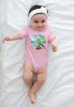 Baby wearing a pink onesie with a parrot design on a white blanket