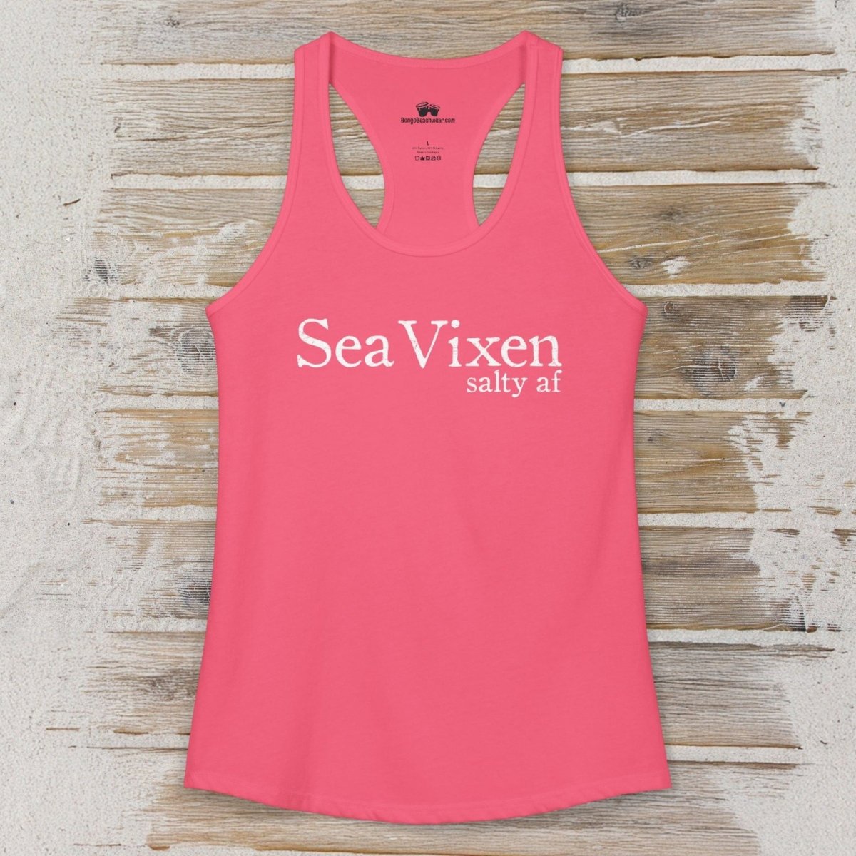 Pink tank top with 'Sea Vixen salty af' text on a wooden surface